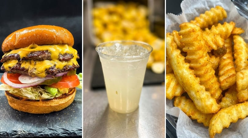 A double cheeseburger with lettuce, tomato, onion, and pickles, a cup of lemonade, and crinkle-cut fries.